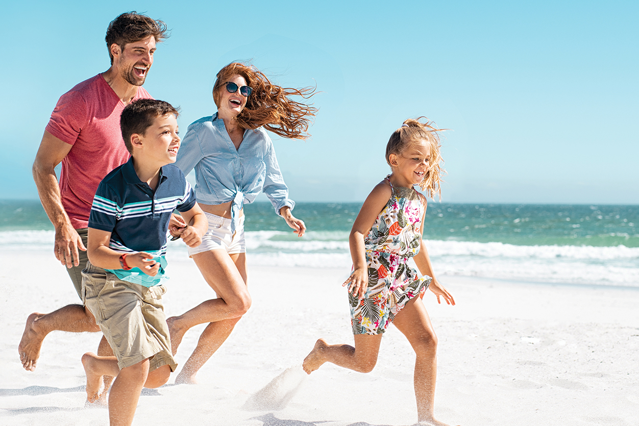 Family running on beach